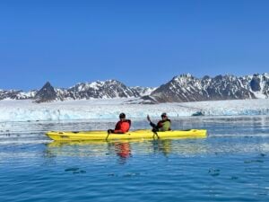 Kayaking near a glacier in the Arctic